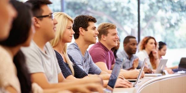 Class Of University Students Using Laptops In Lecture