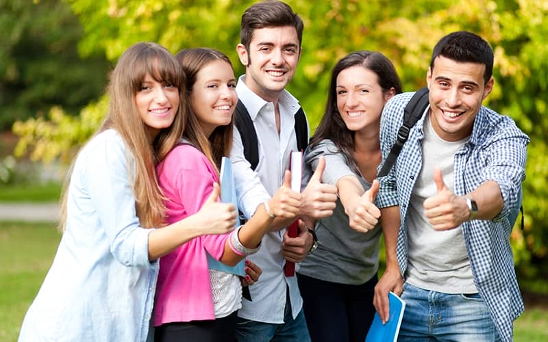 Group of students showing ok sign